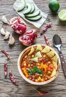 Mexican tortilla soup on the wooden background photo