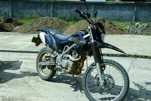 Kuaro Kalimantan timur, Indonesia 01 May 2023. view of a black KLX motorbike parked photo