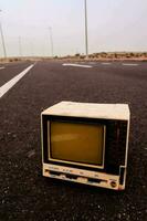 Vintage TV on the ground photo