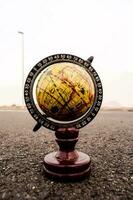 Globe on the road photo