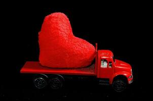 Toy truck carrying an object photo