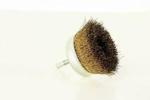 Metal brush on white background photo