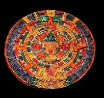 Mayan Calendar on dark background photo