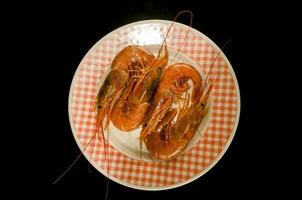 Plate with large shrimps photo