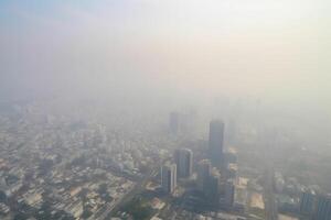Sky view. Air quality in many cities around the world is dangerously low, causing serious health problems for the people who live there. photo