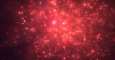 Abstract red energy particles and dots glowing flying sparks festive with bokeh effect and blur background photo