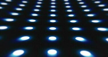 Abstract blue pattern of glowing geometric dots loop futuristic hi-tech black background photo