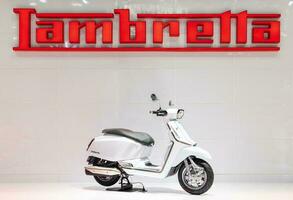 Nonthaburi Thailand 6 December 2022 White Lambretta X300 motorcycle with logo Lambretta on backdrop photo