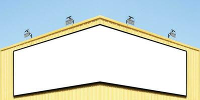 Billboard corner on yellow building with spot light photo