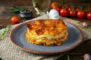 Classic lasagna with minced chiken bolognese sauce and bechamel sauce photo