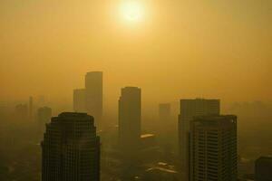 AI Generated Sun struggles to penetrate the smog, casting a sickly yellow glow over everything. photo