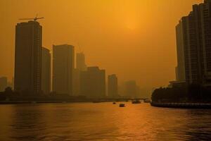 Sun struggles to penetrate the smog, casting a sickly yellow glow over everything. photo