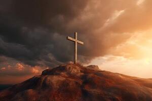 Cross on the top of the mountain with sunset background. photo