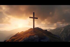 Cross on the top of the mountain with sunset background. photo