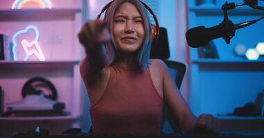 Asian young Esport woman gamer enjoy to play online game on pc photo