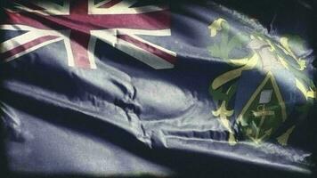 Retro aged Pitcairn Islands flag waving on the wind. Old vintage banner swaying on the breeze. Seamless loop. video