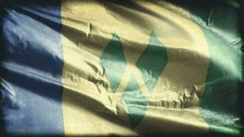 Retro aged Saint Vincent and the Grenadines flag waving on the wind. Old vintage banner swaying on the breeze. Seamless loop. video