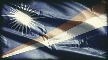 Retro aged Marshall Islands flag waving on the wind. Old vintage banner swaying on the breeze. Seamless loop. video