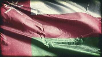 Retro aged Oman flag waving on the wind. Old vintage Omani banner swaying on the breeze. Seamless loop. video