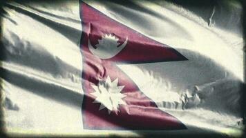 Retro aged Nepal flag waving on the wind. Old vintage Nepali banner swaying on the breeze. Seamless loop. video