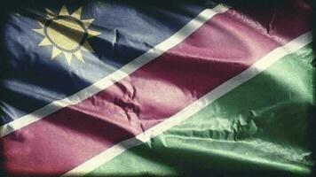 retro Envejecido Namibia bandera ondulación en el viento. antiguo Clásico namib bandera balanceo en el brisa. sin costura bucle. video