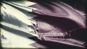 Retro aged Quatar flag waving on the wind. Old vintage Qatari banner swaying on the breeze. Seamless loop. video