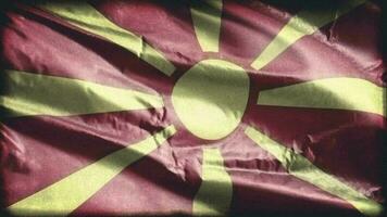 Retro aged Macedonia flag waving on the wind. Old vintage Macedonian banner swaying on the breeze. Seamless loop. video