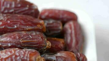 Close up of fresh date fruit in a bowl on table video