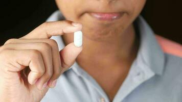 Close up of man hand holding pills with copy space video