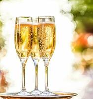 Luxury service, glasses of champagne served by a waiter at a wedding celebration or event in formal English style at luxurious hotel or country estate garden, generative ai photo