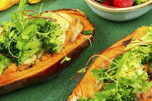 Baked sweet potato with vegetable filling. photo