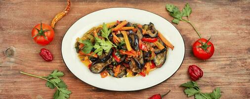 Aubergine saute, tasty vegetable stew. photo