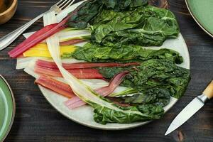 Fried chard on a plate. photo