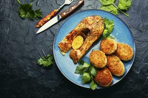 Fried silver carp and fish cutlets photo