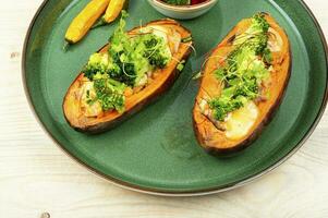 Baked sweet potato with vegetable filling. photo