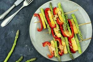 Vegetable skewers with asparagus and cheese. photo