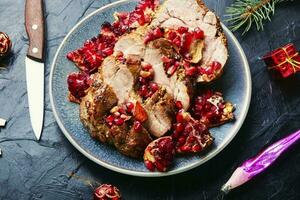 Roasted pork loin with pomegranate for Christmas photo