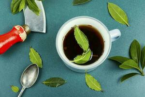 Bay leaf herbal tea in mug photo