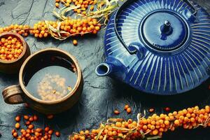 Seasonal healing sea buckthorn tea photo