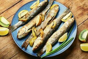 Grilled fish on a plate photo