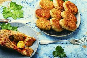 Grilled silver carp and fish cutlets photo