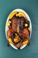 Roast duck with orange photo