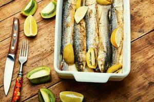 Baked whole fish with kiwi and lime. photo