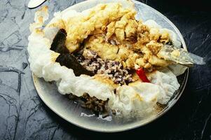 Breaded fish and cooked rice photo