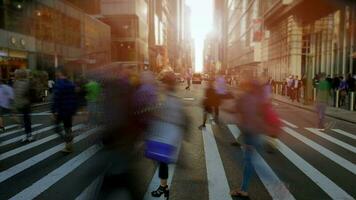 Crowds of people commuting in the city crossing street in rush hour traffic video