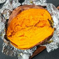 sweet potato baked vegetable meal food snack on the table copy space food background rustic top view photo