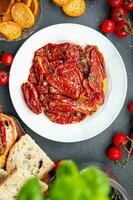 tomato antipasti sun dried food vegetable meal snack on the table copy space food background rustic top view photo