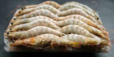 frozen shrimp raw gambas seafood prawn meal food snack on the table copy space food background rustic top view photo