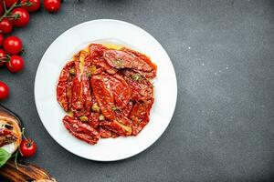 tomato antipasti sun dried food vegetable meal snack on the table copy space food background rustic top view photo