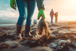 volunteer collects garbage on a muddy beach. The concept of Earth Day. Closeup. photo